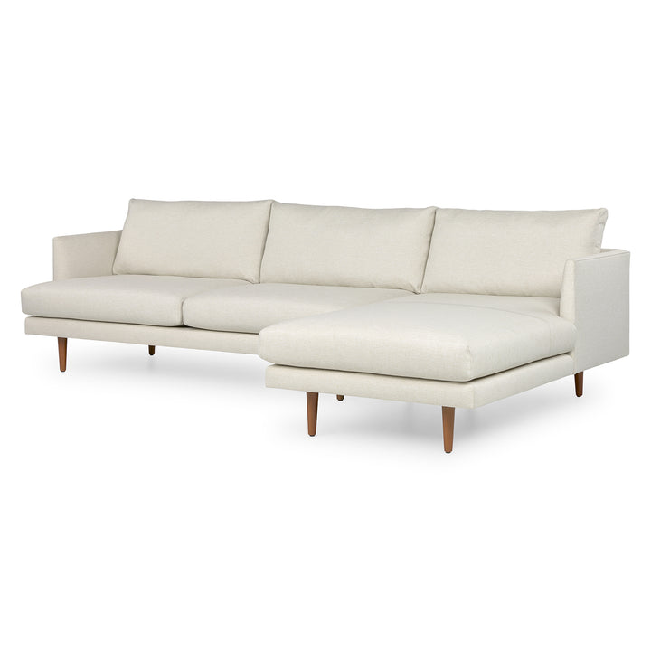 Winters Right green sectional with tapered legs in mid-century modern loft