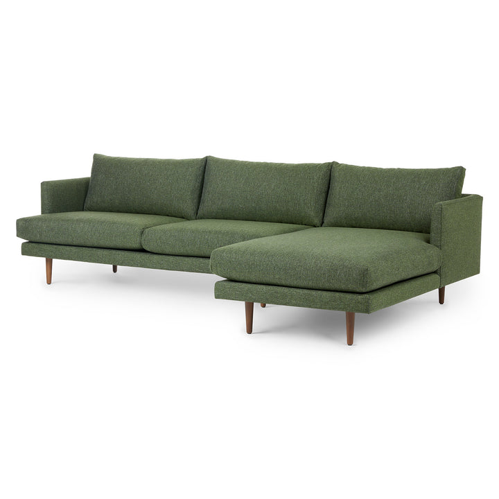 Winters Right green sectional with tapered legs in mid-century modern loft