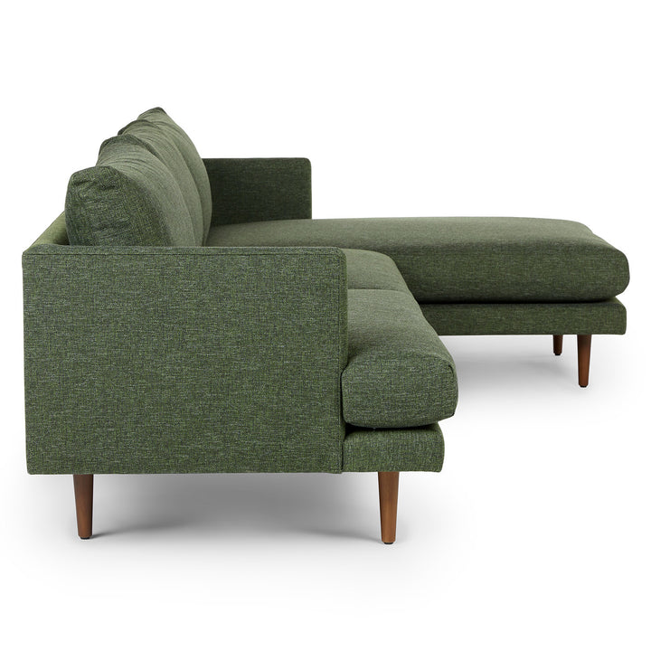 Winters Right green sectional with tapered legs in mid-century modern loft