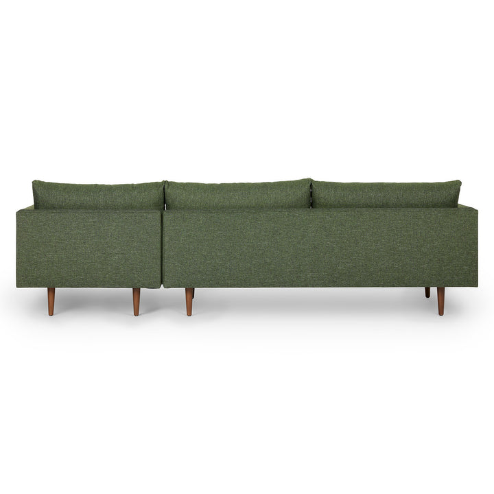 Winters Right green sectional with tapered legs in mid-century modern loft