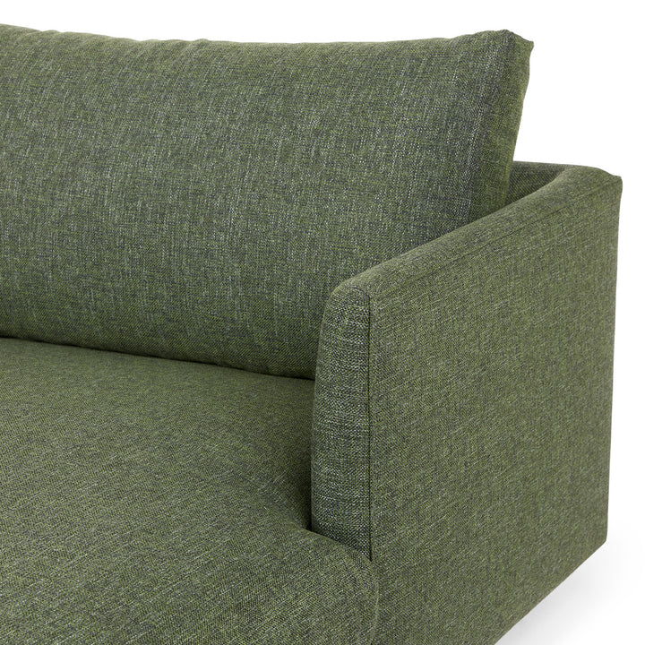 Winters Right green sectional with tapered legs in mid-century modern loft