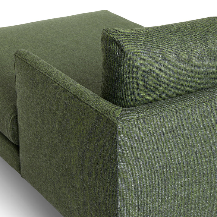 Winters Right green sectional with tapered legs in mid-century modern loft