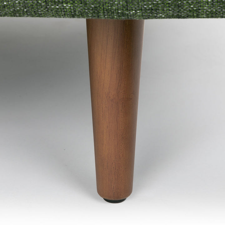 Winters Right green sectional with tapered legs in mid-century modern loft